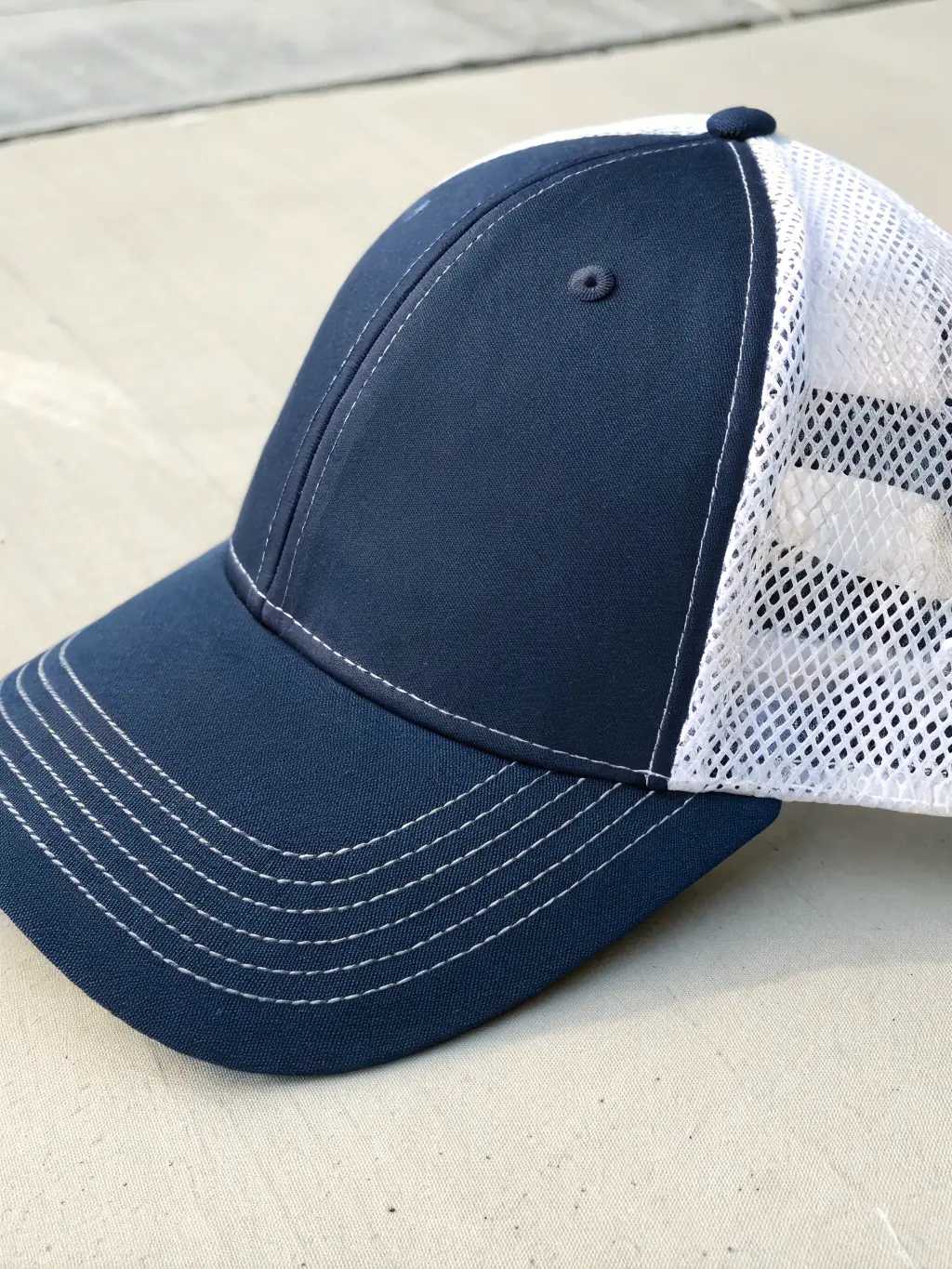 A variety of custom-printed caps with different logos and designs, demonstrating the range of customization options available for headwear.